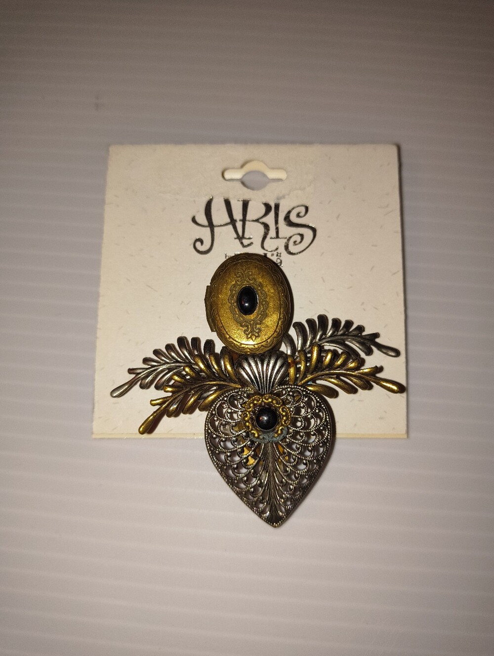 Aris Two-Tone Filigree Heart Brooch with Black Cabochons